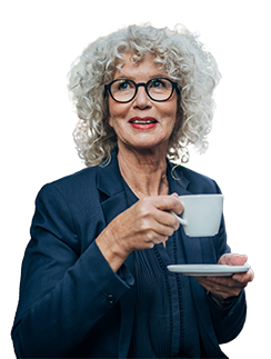 Mature woman with grey curly hair holding a cofee cup